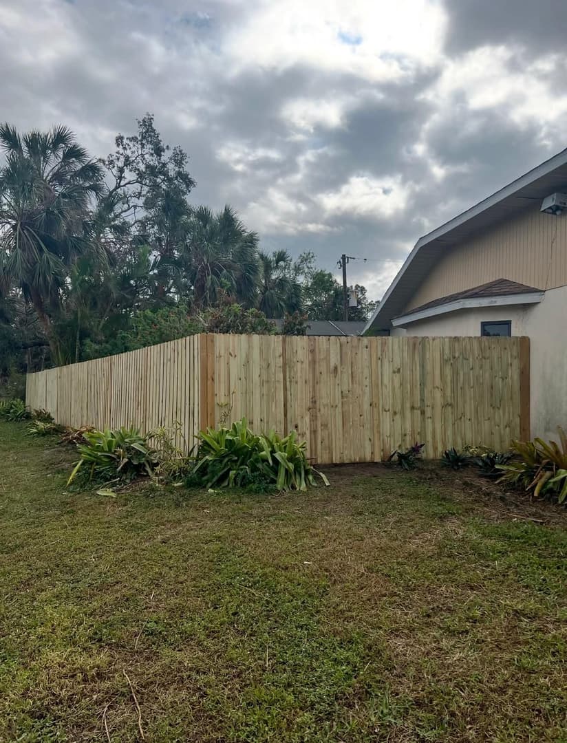 Pressure-treated wood privacy fence installation in North Port