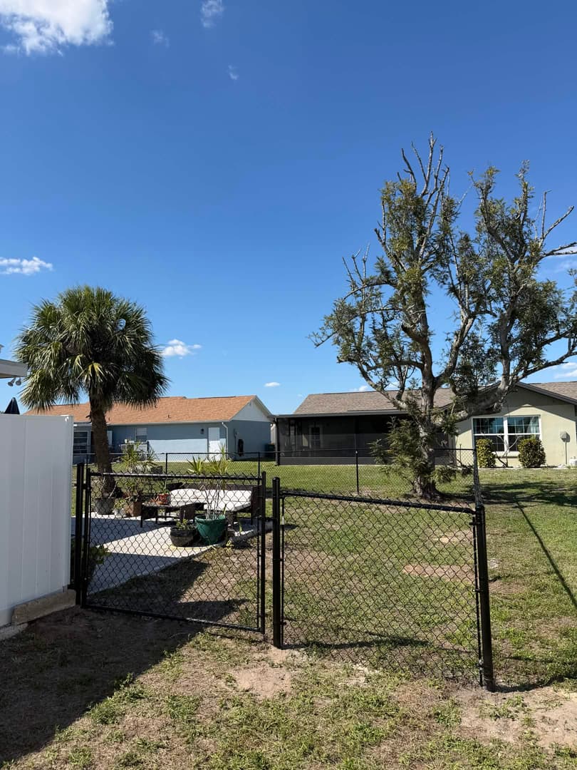 Professional landscaping with manicured lawn and trimmed hedges in North Port FL